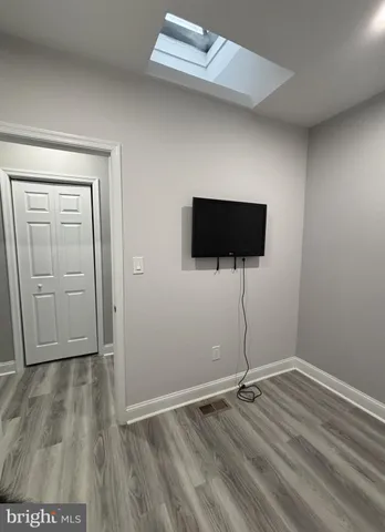 a view of a livingroom with wooden floor