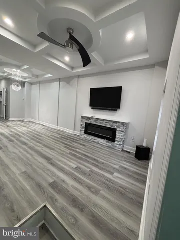 a room with a flat screen tv and a fireplace