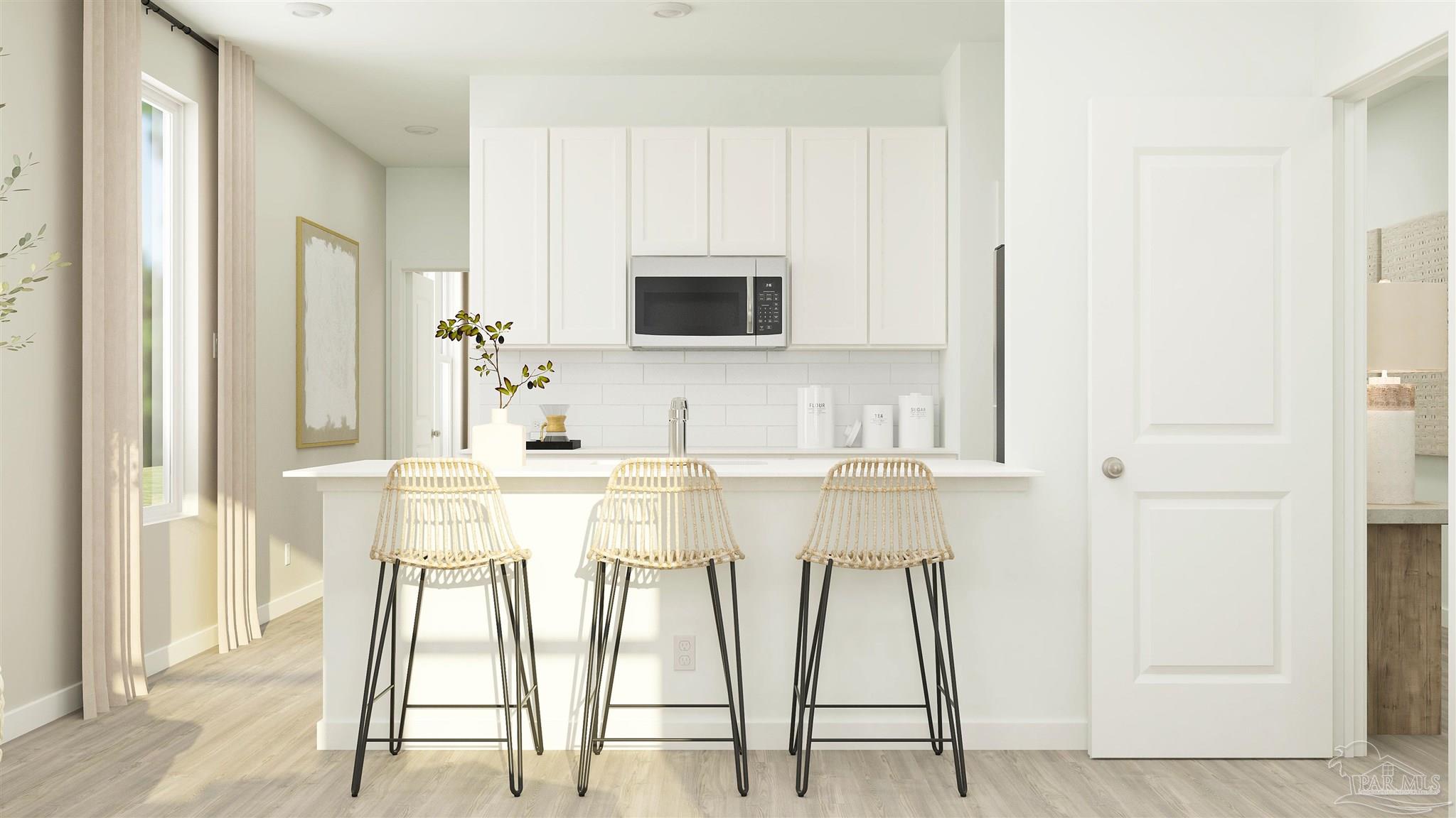 5964 Briarcliff Lane Pace, FL 32571 - Photo 15 of 28 a kitchen with stainless steel appliances kitchen island granite countertop a table and chairs