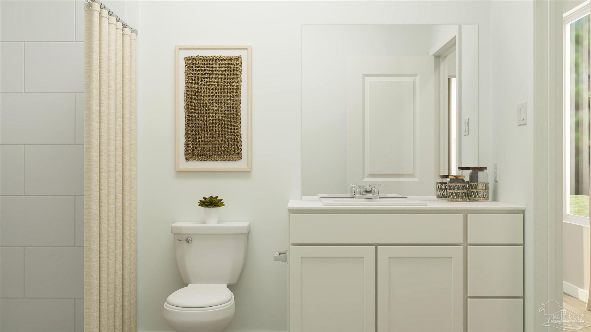 5964 Briarcliff Lane Pace, FL 32571 - Photo 21 of 28 a bathroom with a sink a toilet and mirror