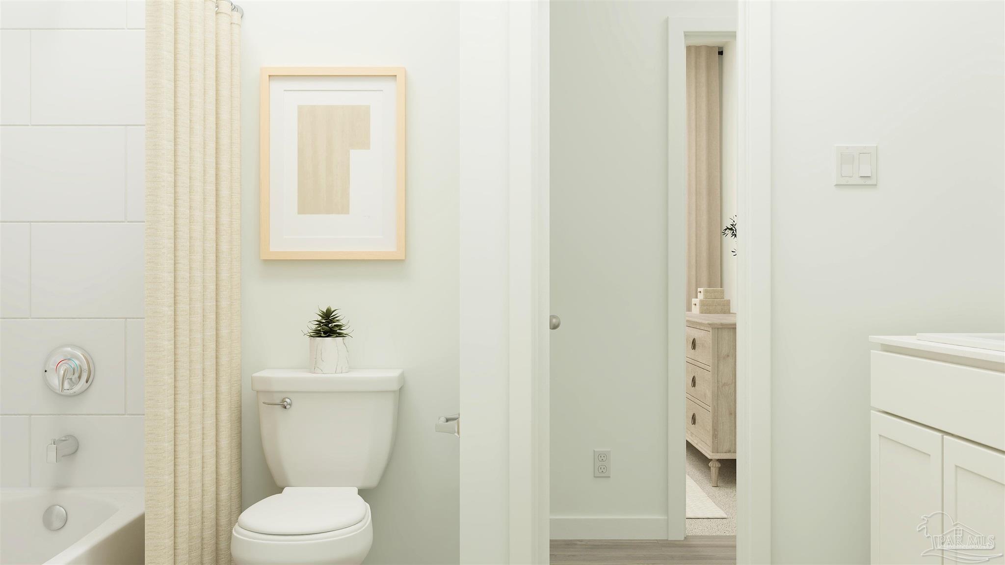 5964 Briarcliff Lane Pace, FL 32571 - Photo 24 of 28 a white toilet sitting next to a bathroom sink