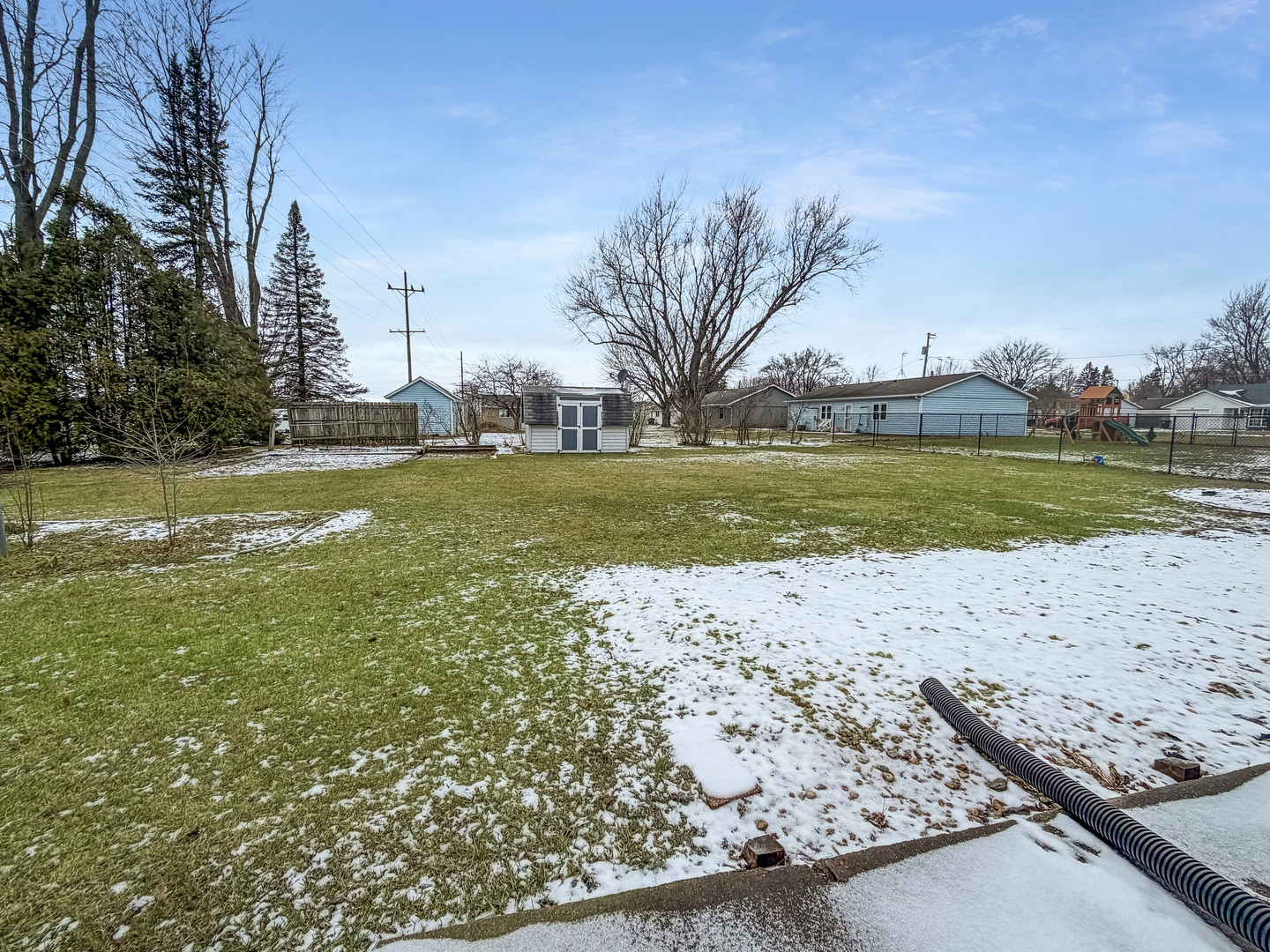 711 Virginia Avenue Lena, IL 61048 - Photo 3 of 30 a view of a lake with a beach