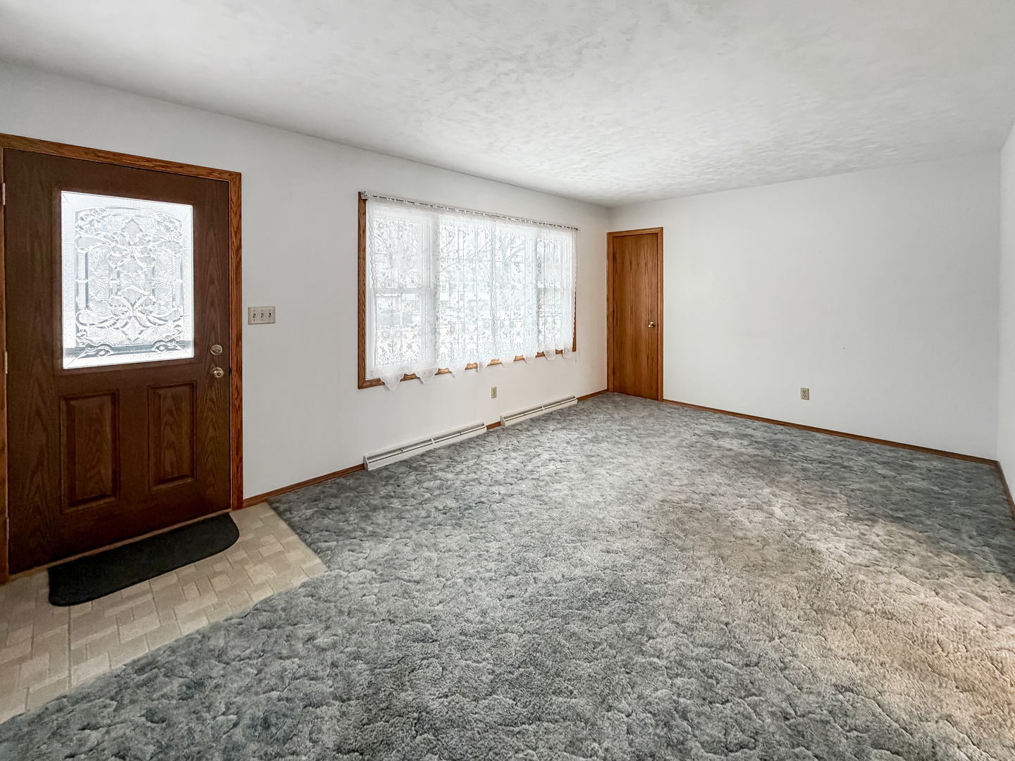711 Virginia Avenue Lena, IL 61048 - Photo 8 of 30 an empty room with windows