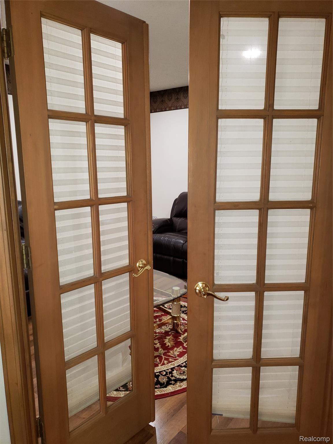 21970 River Ridge Trail, Unit 72 Farmington, MI 48335 - Photo 10 of 38 French Doors to Bedroom/Library