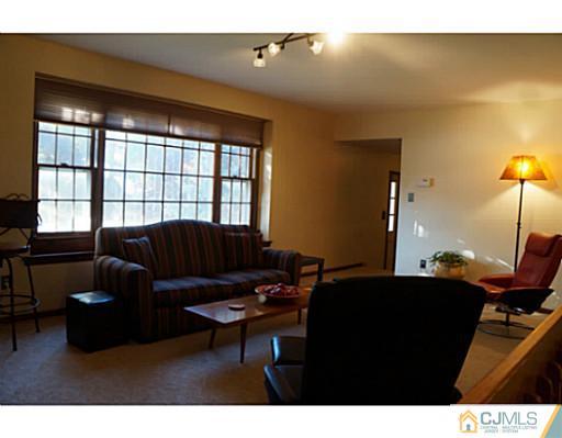 804 New Dover Road Edison, NJ 08820 - Photo 8 of 20 a living room with furniture and a window