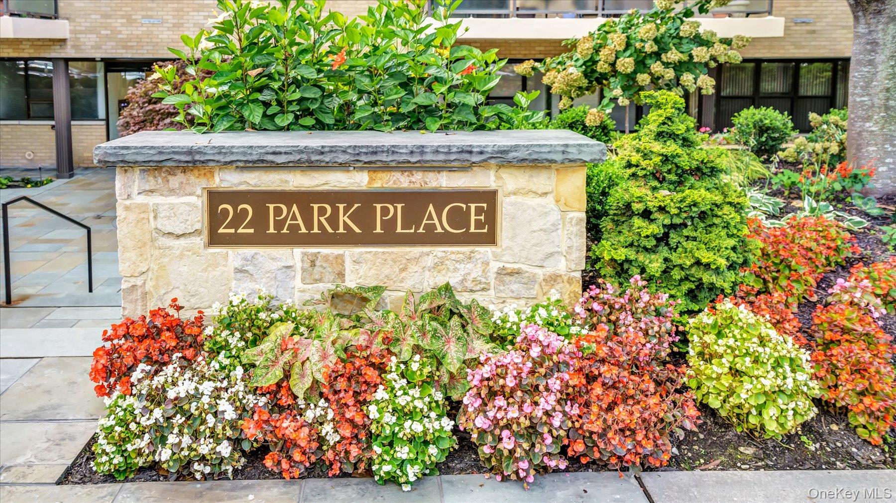22 Park Place, Unit 4T Great Neck, NY 11021 - Photo 13 of 13 a view of sign board with potted plants
