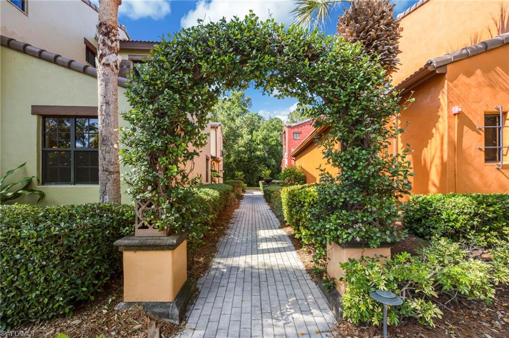 9145 Chula Vista Street, Unit 13004 Naples, FL 34113 - Photo 24 of 24 a view of a pathway with a patio