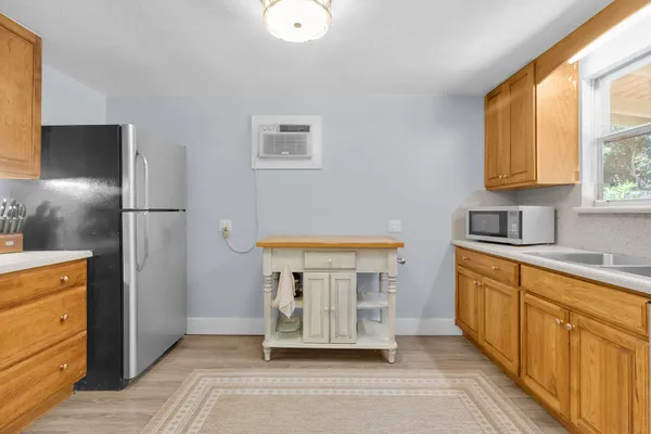 a kitchen with stainless steel appliances a refrigerator and a sink