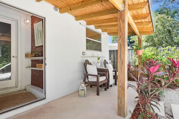 a view of a backyard with a tree