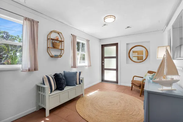 a living room with furniture and a window