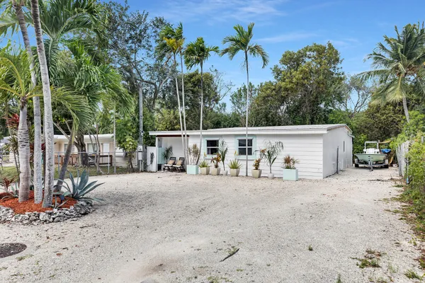a view of a backyard of the house