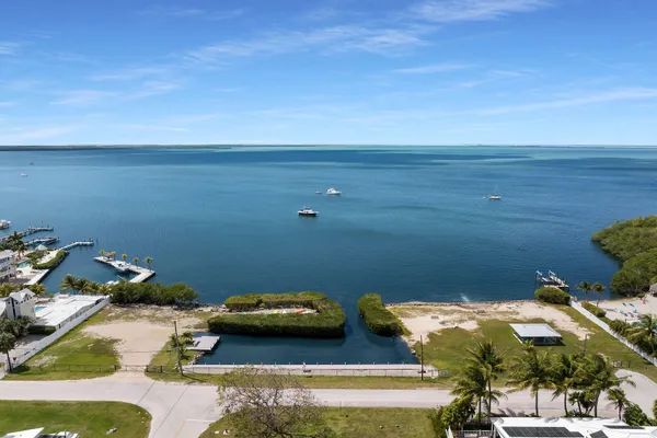 a view of a swimming pool and a yard