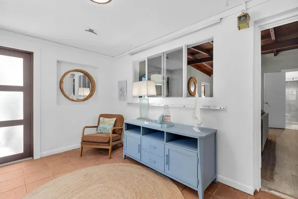 a view of dining room with wooden floor and white walls