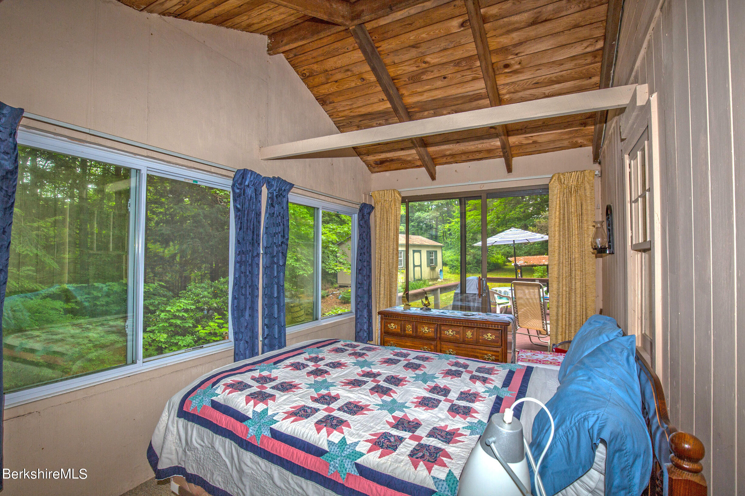 1146 East Otis Road Otis, MA 01029 - Photo 14 of 20 a bed sitting in a bedroom next to a window