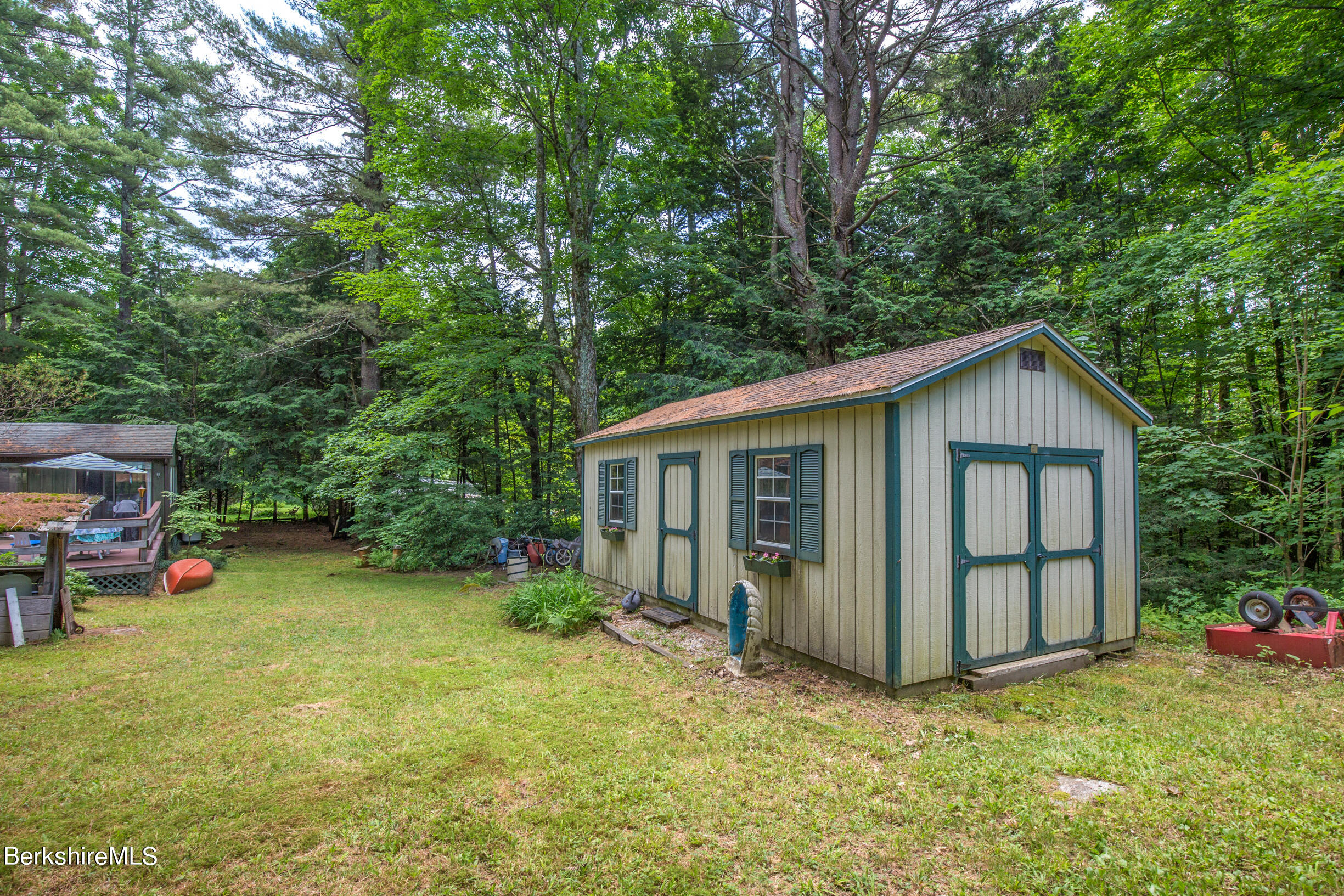 1146 East Otis Road Otis, MA 01029 - Photo 19 of 20 a view of a house with a yard and fence
