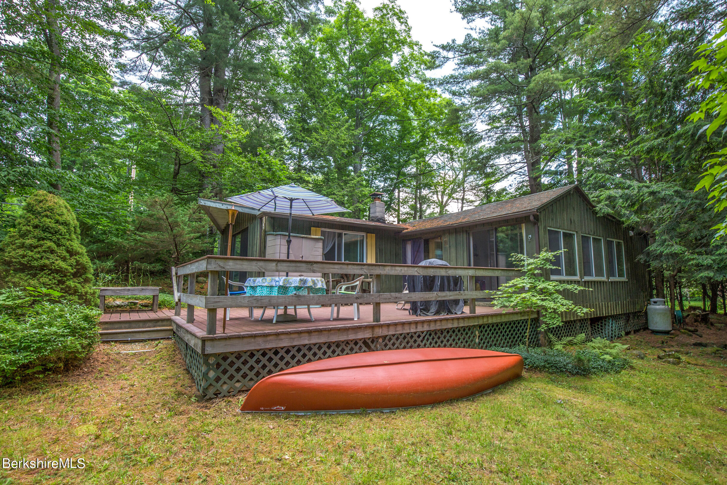 1146 East Otis Road Otis, MA 01029 - Photo 20 of 20 a backyard of a house with yard fire pit and outdoor seating