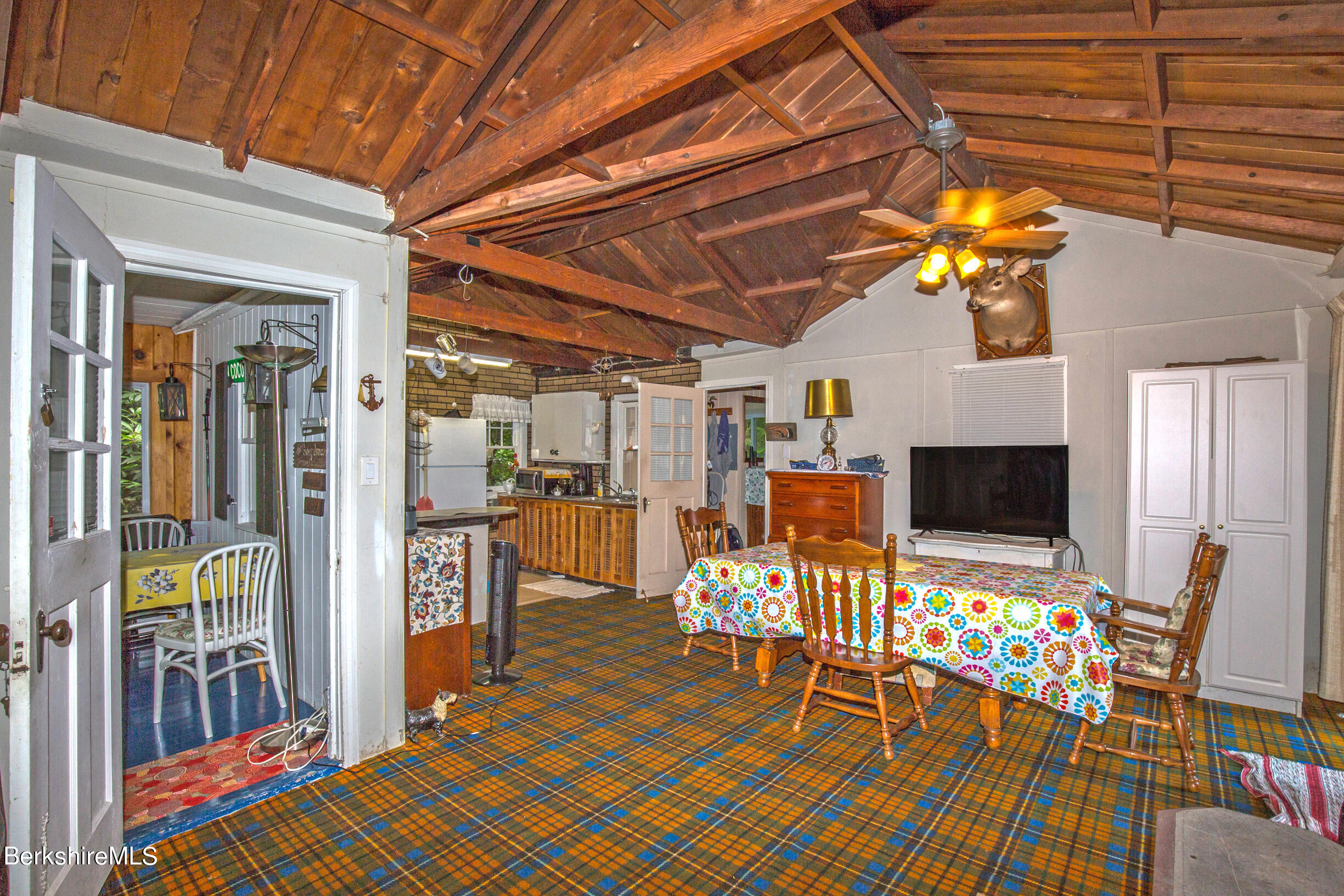 1146 East Otis Road Otis, MA 01029 - Photo 8 of 20 a view of a dining room with furniture and chandelier