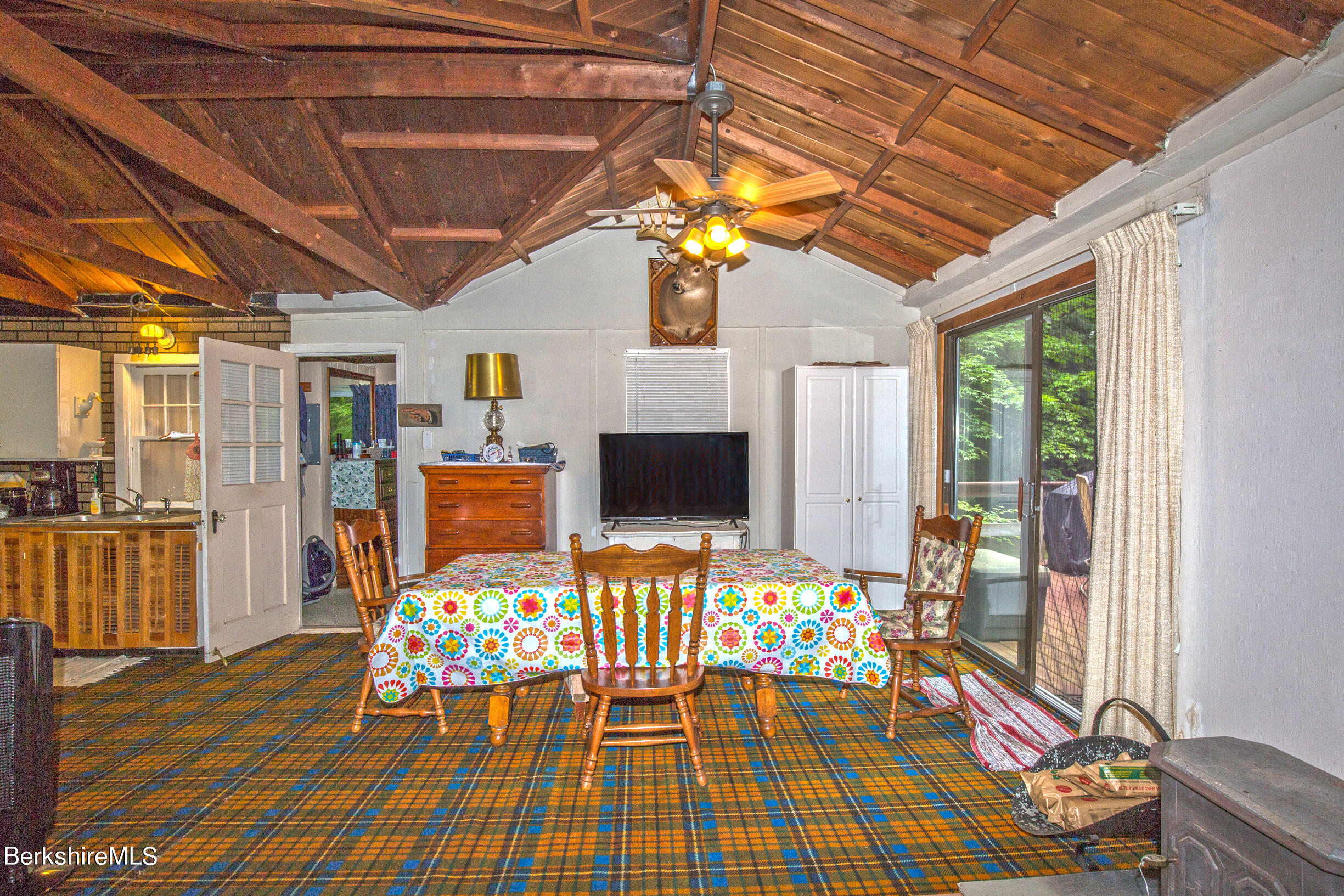 1146 East Otis Road Otis, MA 01029 - Photo 9 of 20 a outdoor space with lots of furniture and wooden floor