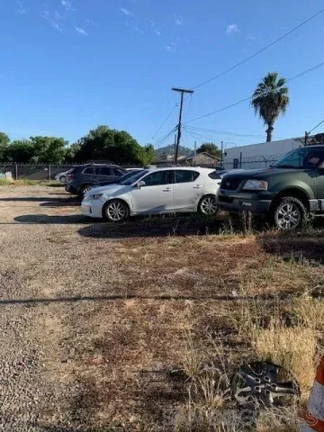 a view of a cars parked in a yard