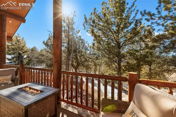 a view of a two chairs in the deck