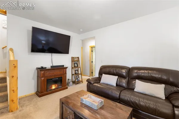 a view of a bedroom with a door and wooden door
