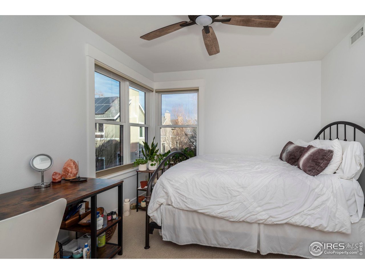 2058 Walnut Street, Unit A Boulder, CO 80302 - Photo 13 of 38 a bedroom with a bed window and a potted plant