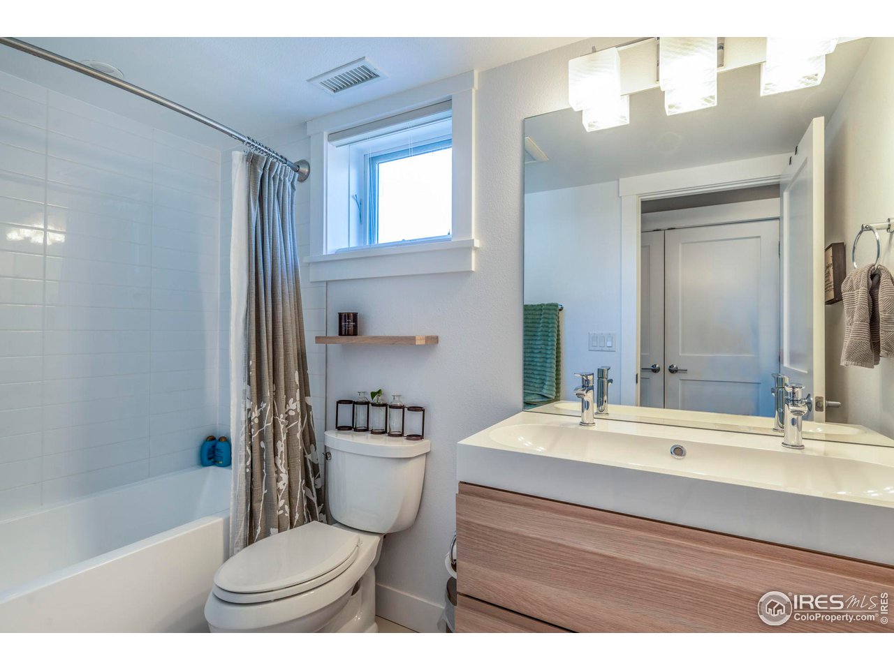 2058 Walnut Street, Unit A Boulder, CO 80302 - Photo 14 of 38 a bathroom with a sink a toilet and a bathtub