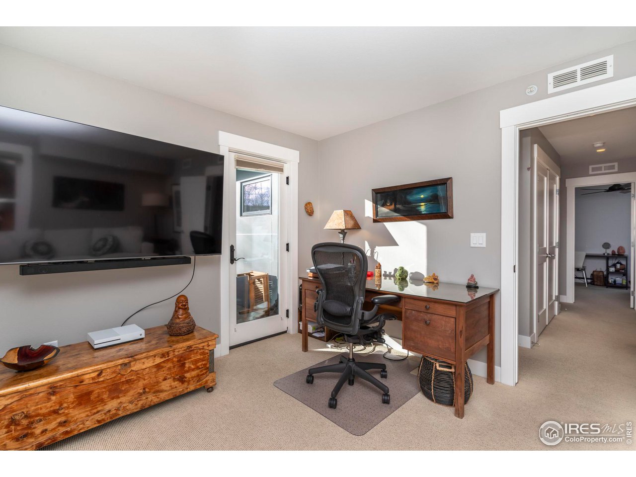 2058 Walnut Street, Unit A Boulder, CO 80302 - Photo 16 of 38 a living room with furniture rug and view of kitchen