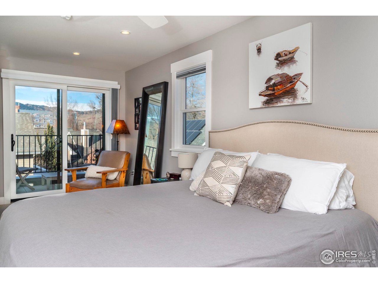 2058 Walnut Street, Unit A Boulder, CO 80302 - Photo 20 of 38 a bed room with a bed and a painting on the wall
