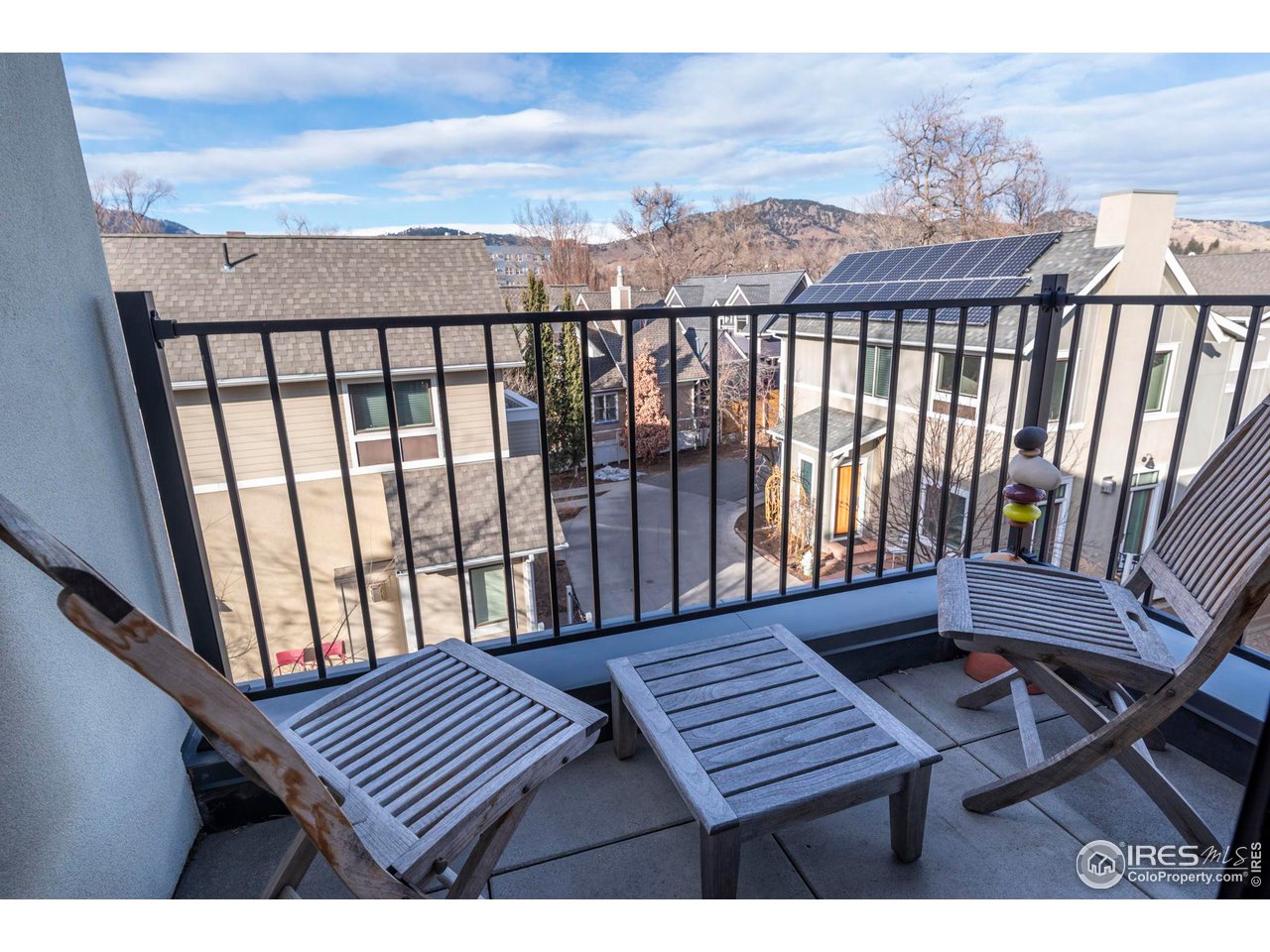 2058 Walnut Street, Unit A Boulder, CO 80302 - Photo 21 of 38 a view of a balcony with wooden chairs