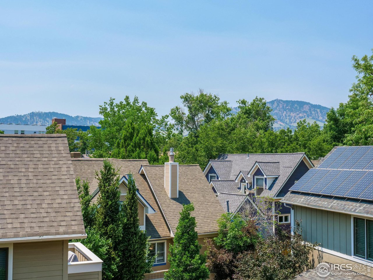 2058 Walnut Street, Unit A Boulder, CO 80302 - Photo 22 of 38 an aerial view of a house with a yard and mountain view in back