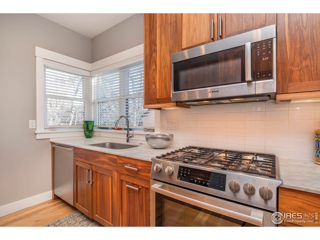 2058 Walnut Street, Unit A Boulder, CO 80302 - Photo 4 of 38 a kitchen with a stove and a microwave