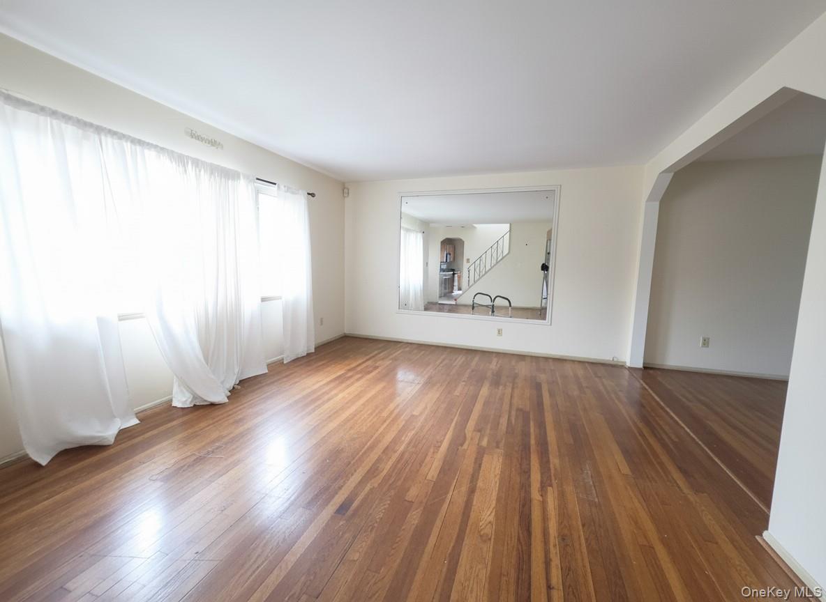 863 North Street Peekskill, NY 10566 - Photo 2 of 24 Living room with large window and wood floors. Floor 1.