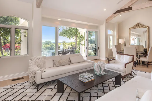 a view of a lake with a bench under an umbrella
