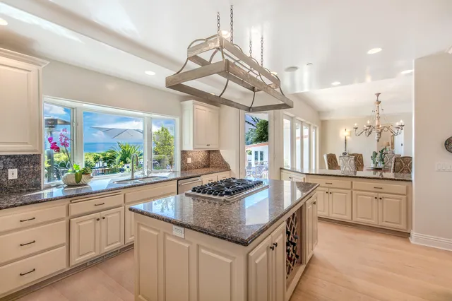 a view of a swimming pool with a patio and plants