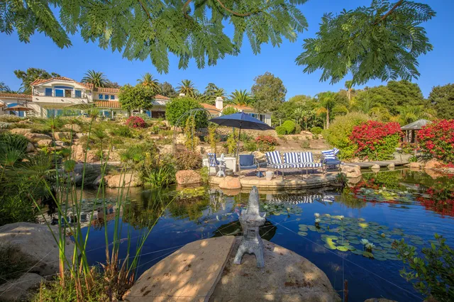 a kitchen with granite countertop a sink and cabinets