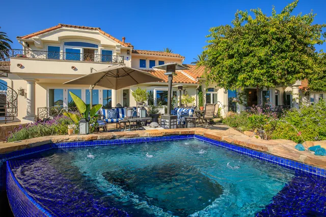 a view of a swimming pool with a patio