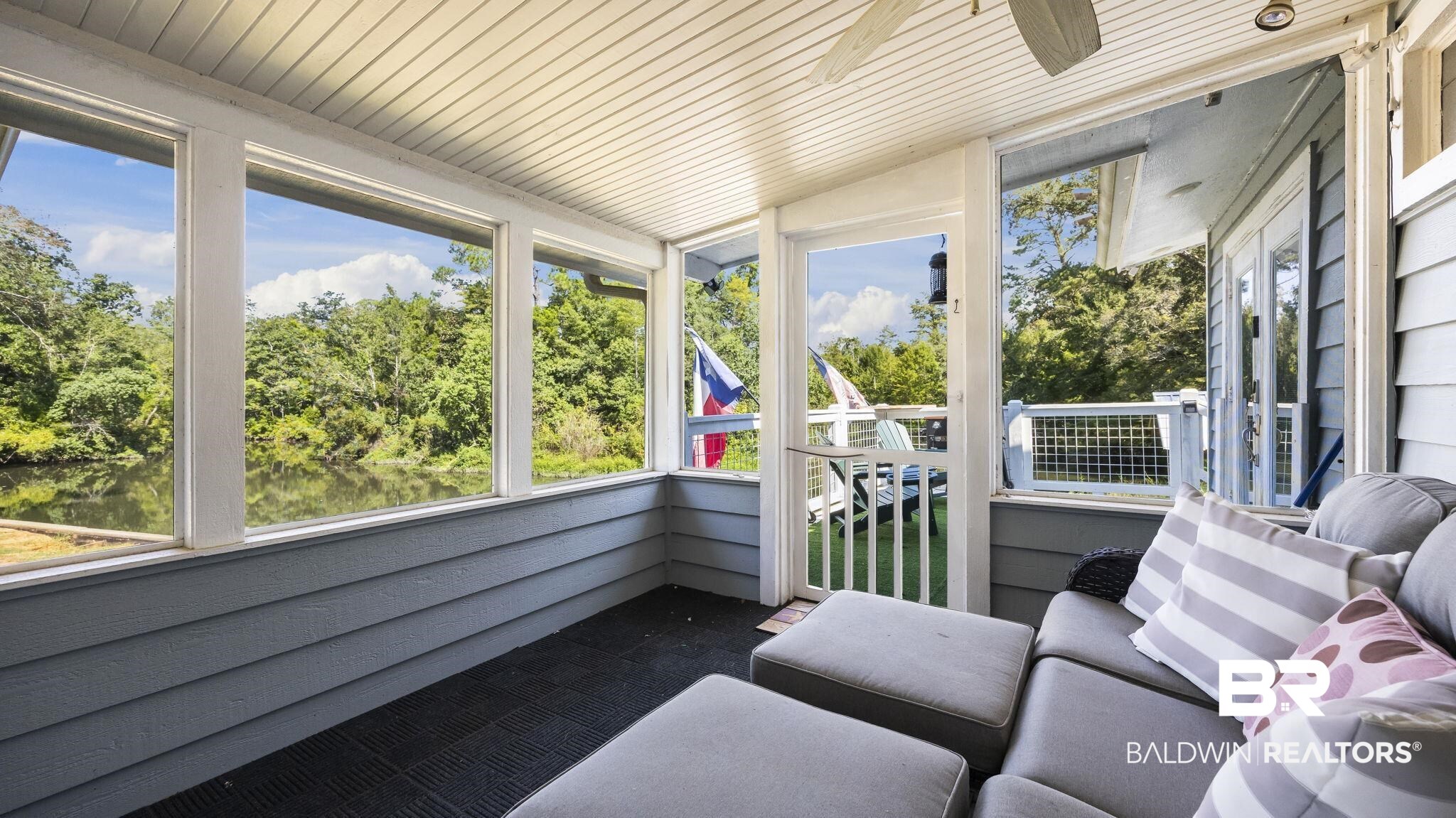 12855 Woodhaven Dairy Road West Silverhill, AL 36576 - Photo 11 of 27 Sunroom featuring view of scattered trees, an outdoor hangout area, and ceiling fan