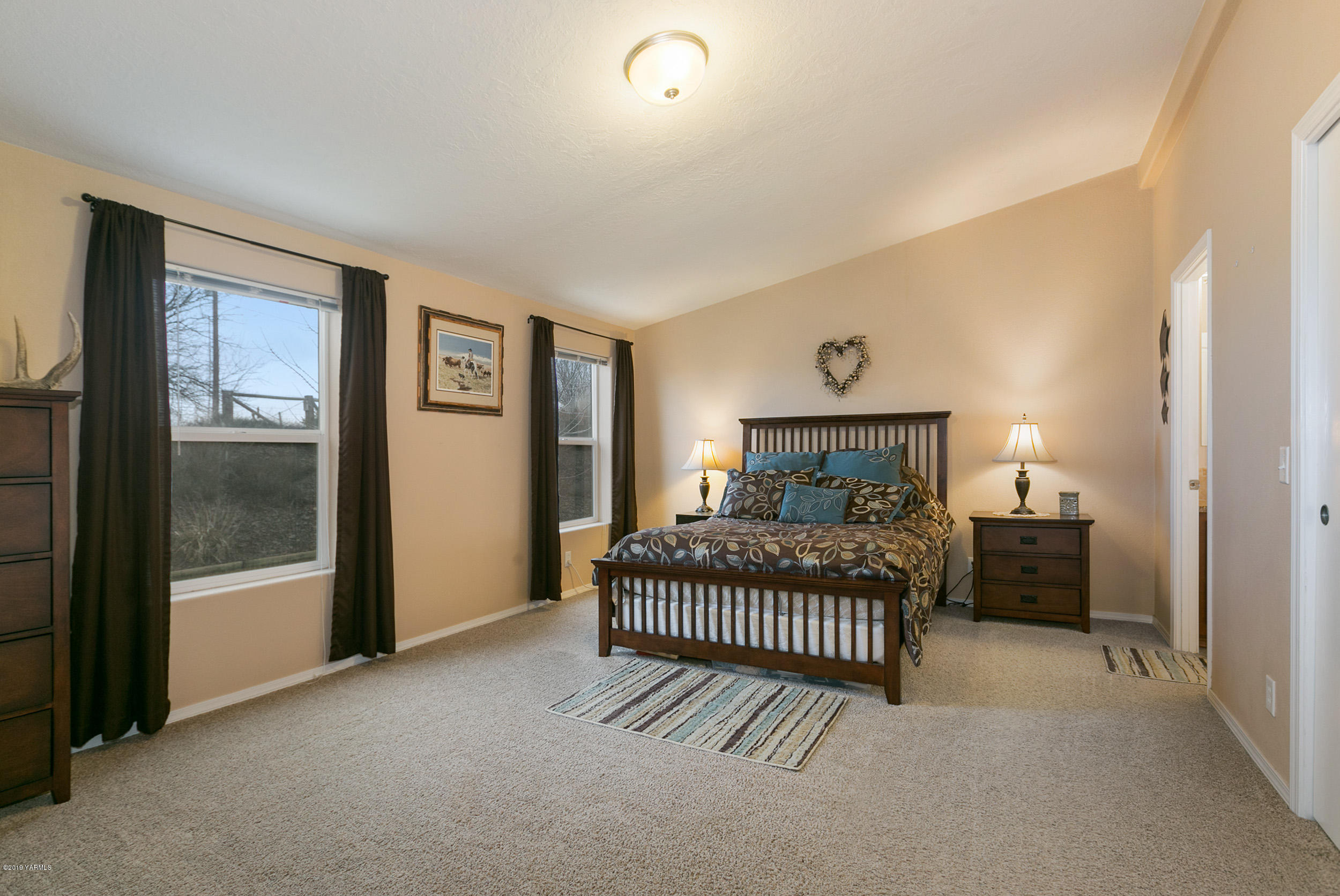 177 Division Road Zillah, WA 98953 - Photo 14 of 23 a bedroom with a bed and a window