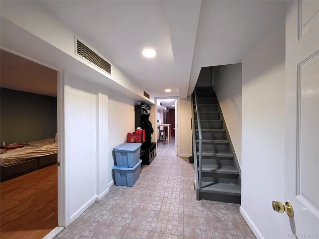 a view of a hallway to closet and wooden floor
