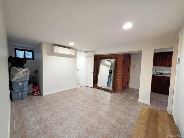a view of empty room with closet and fireplace