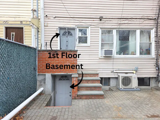 a couple of cars parked in front of a house