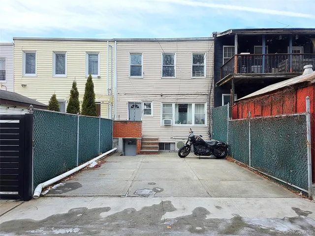 a view of a street with trees on both side of it