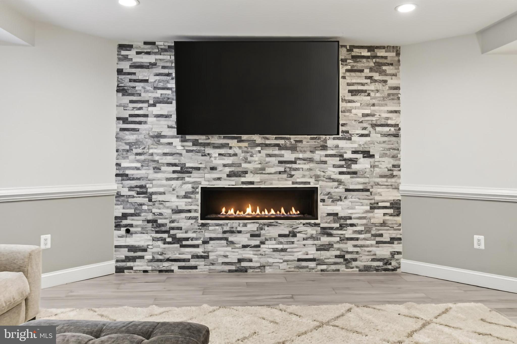 8836 Rommel Drive Lorton, VA 22079 - Photo 79 of 133 Stack stone gas fireplace