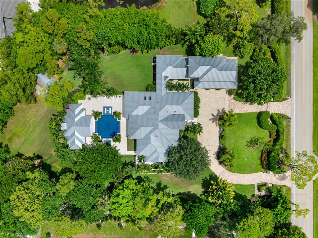 233 Ridge Drive Naples, FL 34108 - Photo 2 of 39 an aerial view of a house with a yard