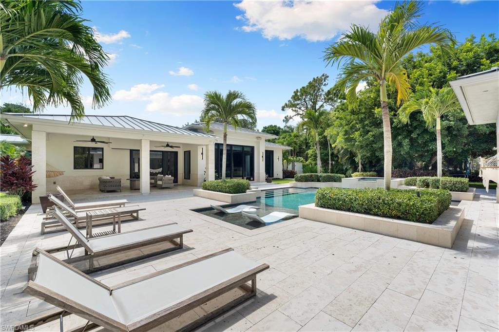 233 Ridge Drive Naples, FL 34108 - Photo 22 of 39 a view of a house with backyard and sitting area