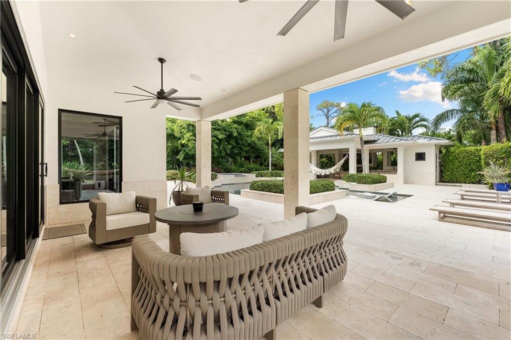 233 Ridge Drive Naples, FL 34108 - Photo 26 of 39 a living room with furniture and a large window