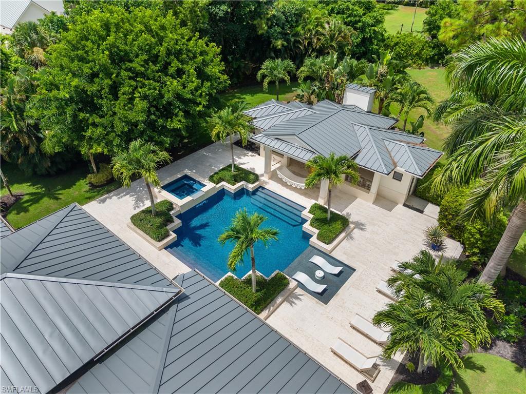 233 Ridge Drive Naples, FL 34108 - Photo 3 of 39 an aerial view of a house with a garden