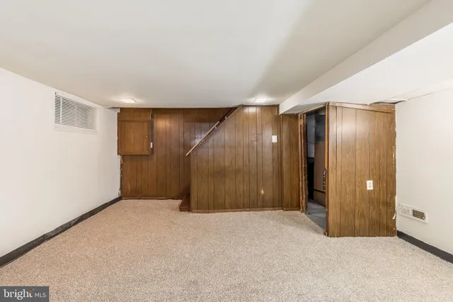 an empty room with a wooden door