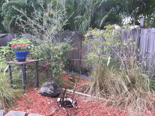 a view of outdoor space with a wooden fence